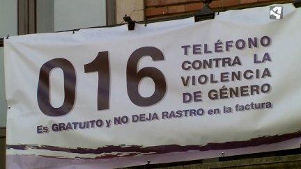 Cartel con el teléfono contra la violencia de género