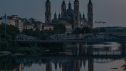 El eclipse solar total sobre la basílica del Pilar y reflejado en el Ebro, la imagen del Día de la NASA