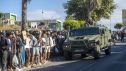 Migrantes esperan en una cola, a 24 de agosto de 2026, en Ceuta (España).