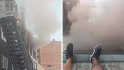 Imágenes de cómo un vecino ha logrado escapar por el tejado de un incendio en el barrio zaragozano del Arrabal.